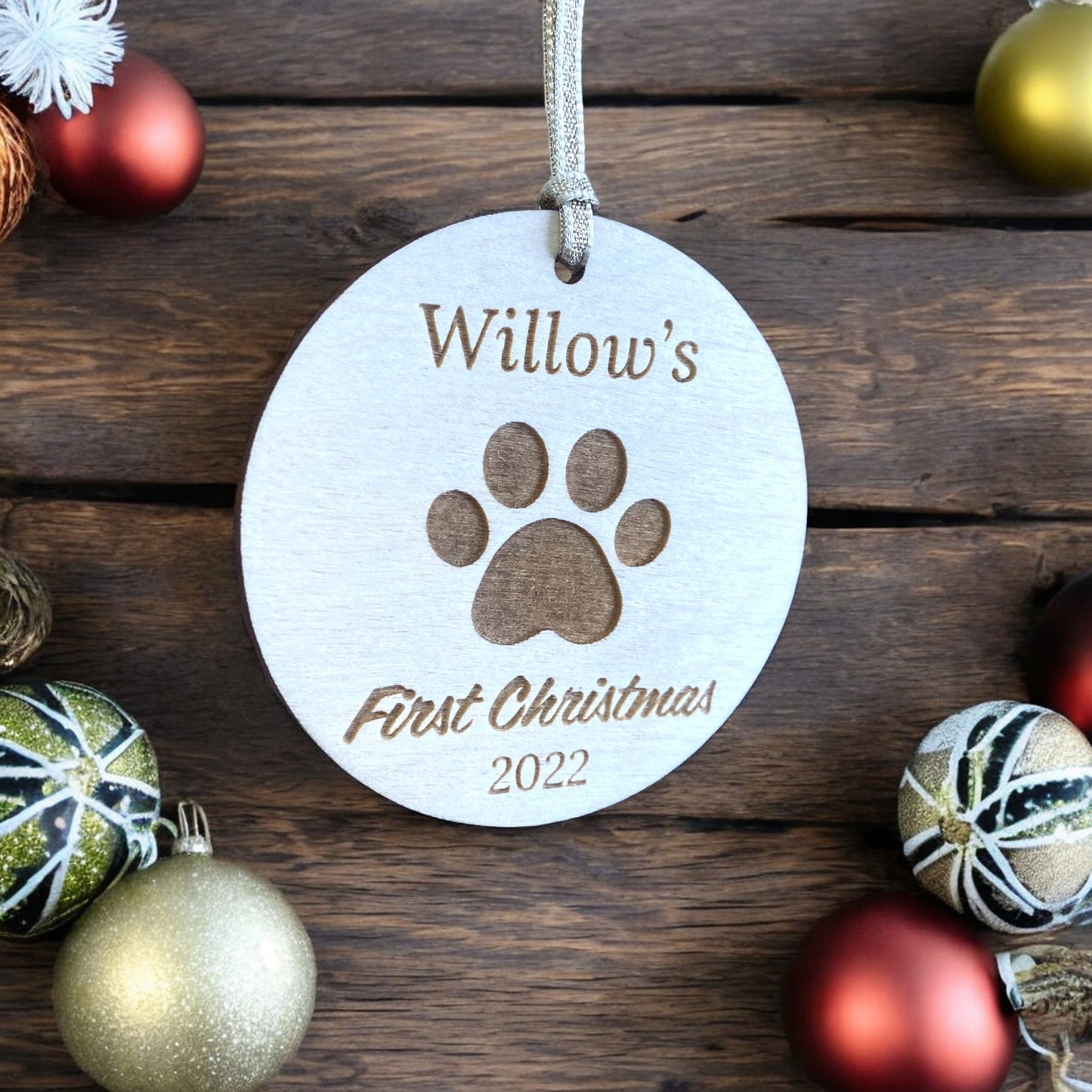 Personalised Wooden Dog Paw First Christmas Bauble